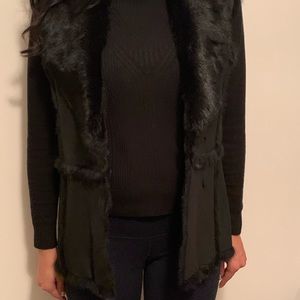 Black for sleeveless vest in good condition